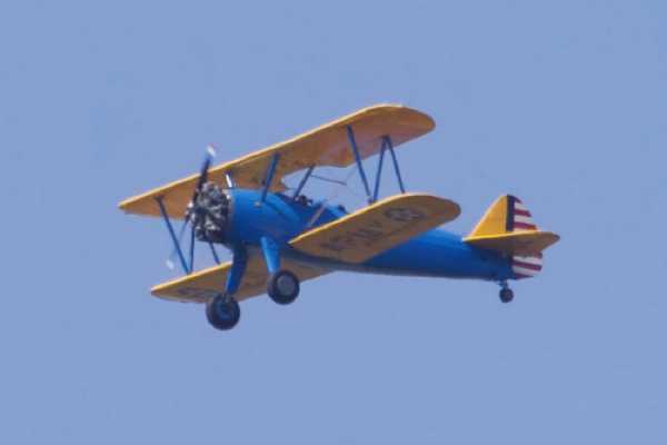 14 August 2022 - 14:05:56
Over 10,000 of these were built. This one dates from 1943 and was a US Navy trainer. Sounded wonderful as she flew over BRNC heading west.
------------------
Boeing Stearman Kaydet  biplane N4545N
